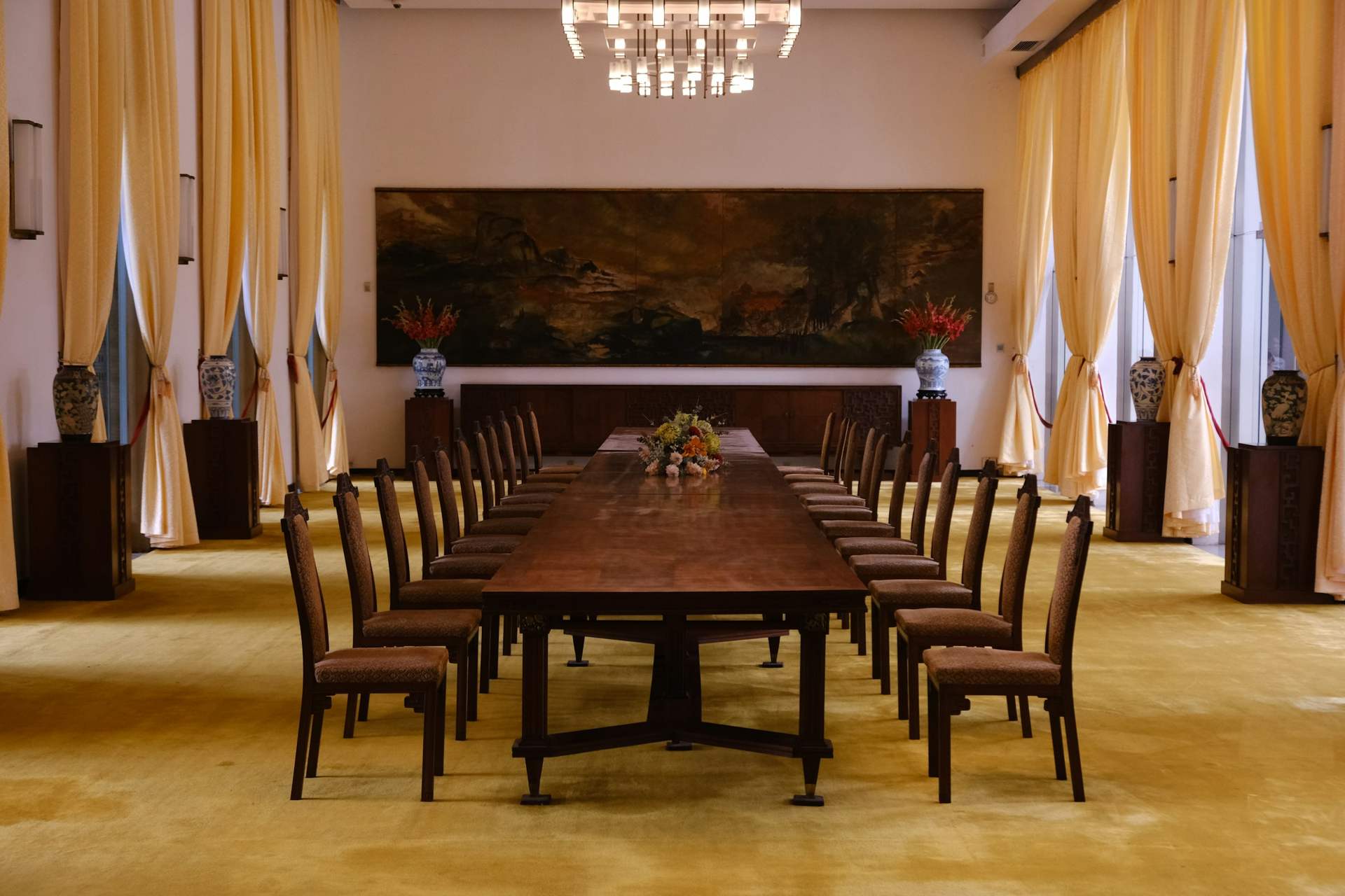A long boardroom table with chairs